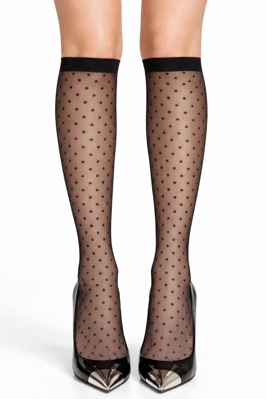 Black polka dot sheer stockings with black shoes on a white background
