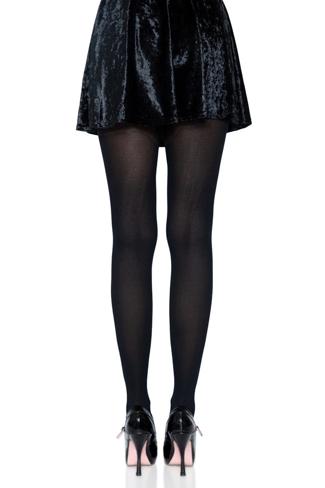 
                      
                        Black tights worn with a black skirt on a white background
                      
                    