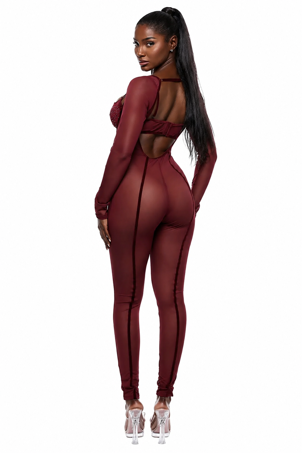 A woman modeling a form-fitting, long-sleeve burgundy jumpsuit with a cutout back, shown from the back against a plain white background.