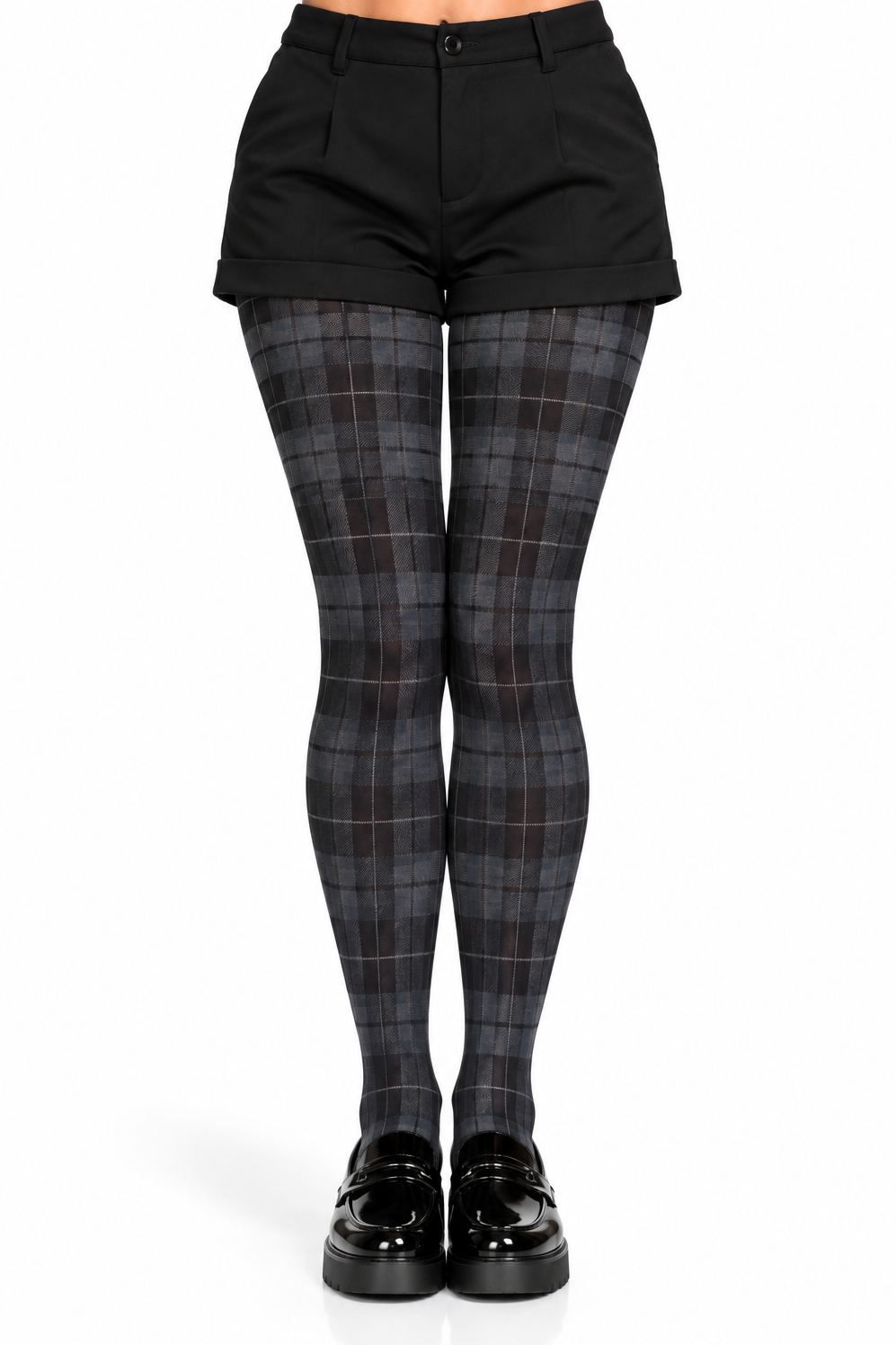 A model's lower body wearing black shorts, dark gray and black plaid tights, and black platform loafers, shown against a plain white background.