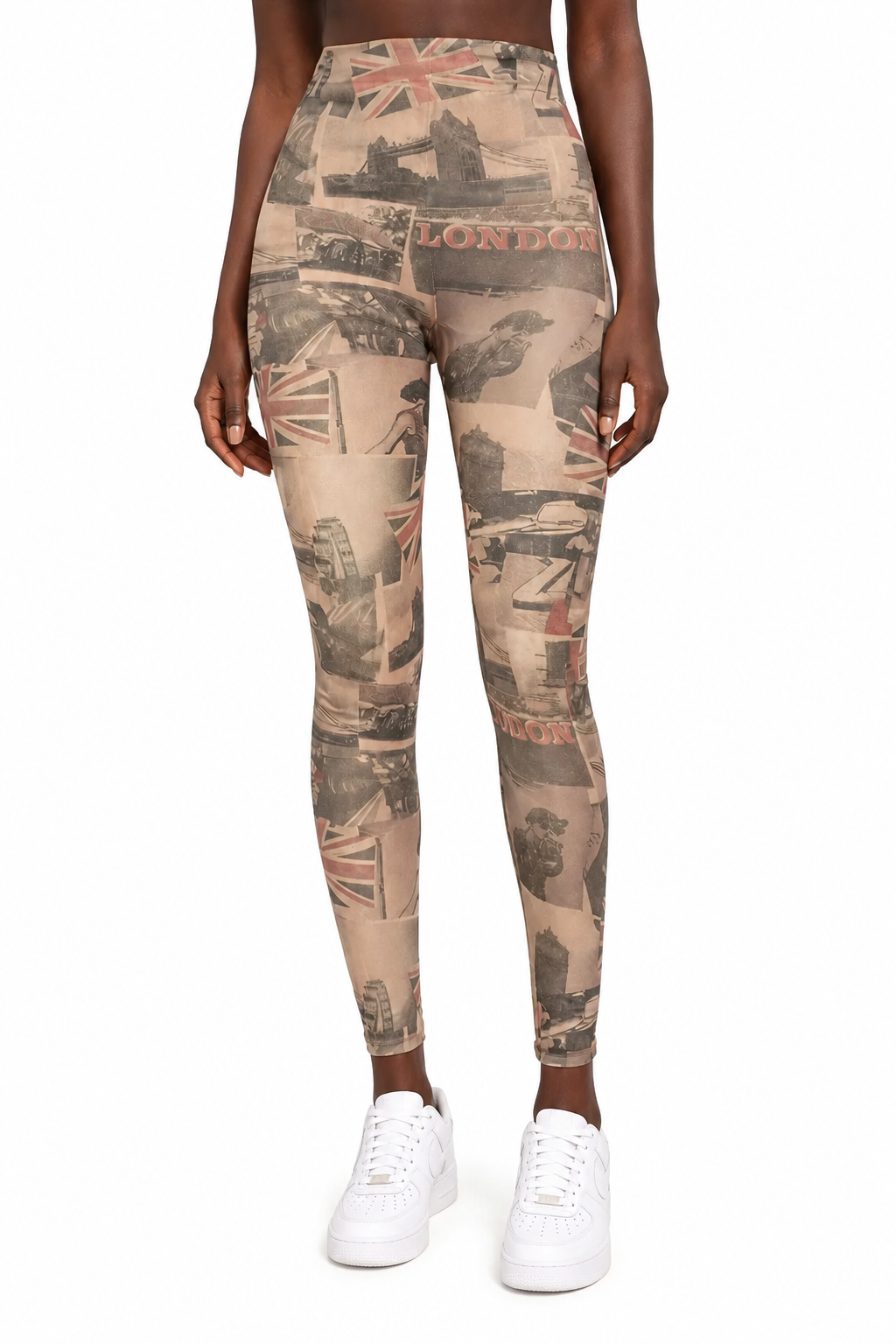 A model from the waist down wearing high-waisted leggings with a vintage London collage print in beige, brown, and red, paired with white sneakers on a white background.