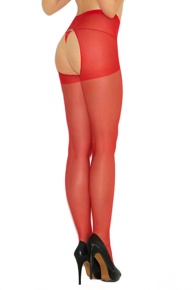 Woman wearing a black top and red fishnet stockings on a white background