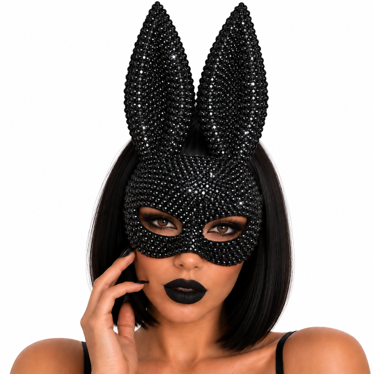 A woman wearing a black bunny mask embellished with sparkling rhinestones, featuring tall upright bunny ears. She has black hair, black lipstick, and is posing against a solid white background.