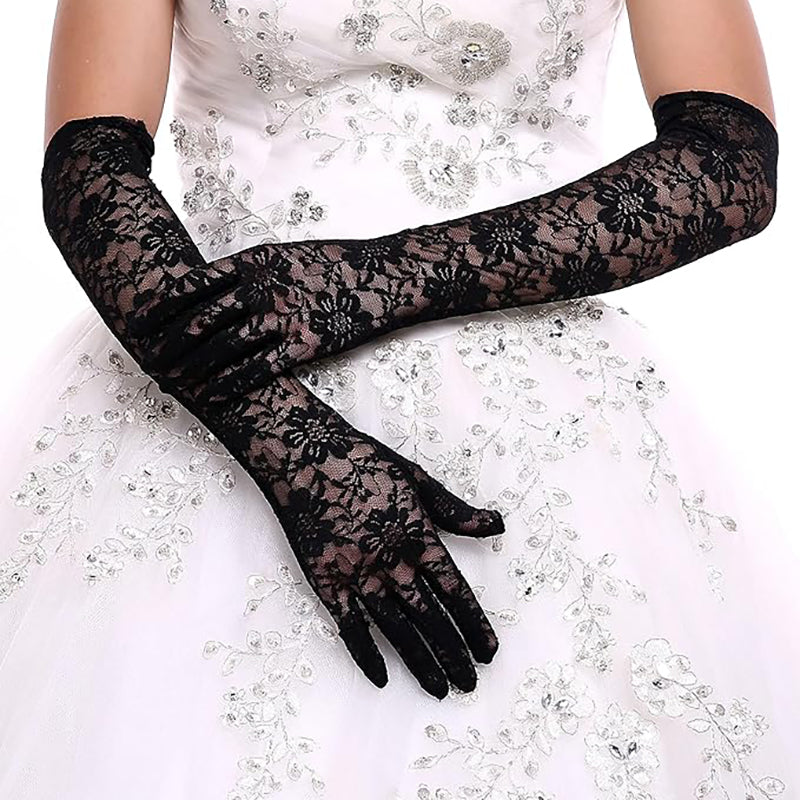 
                      
                        Black lace gloves worn by a person on a white background
                      
                    