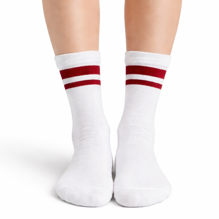 White socks with red stripes worn by a person on a white background