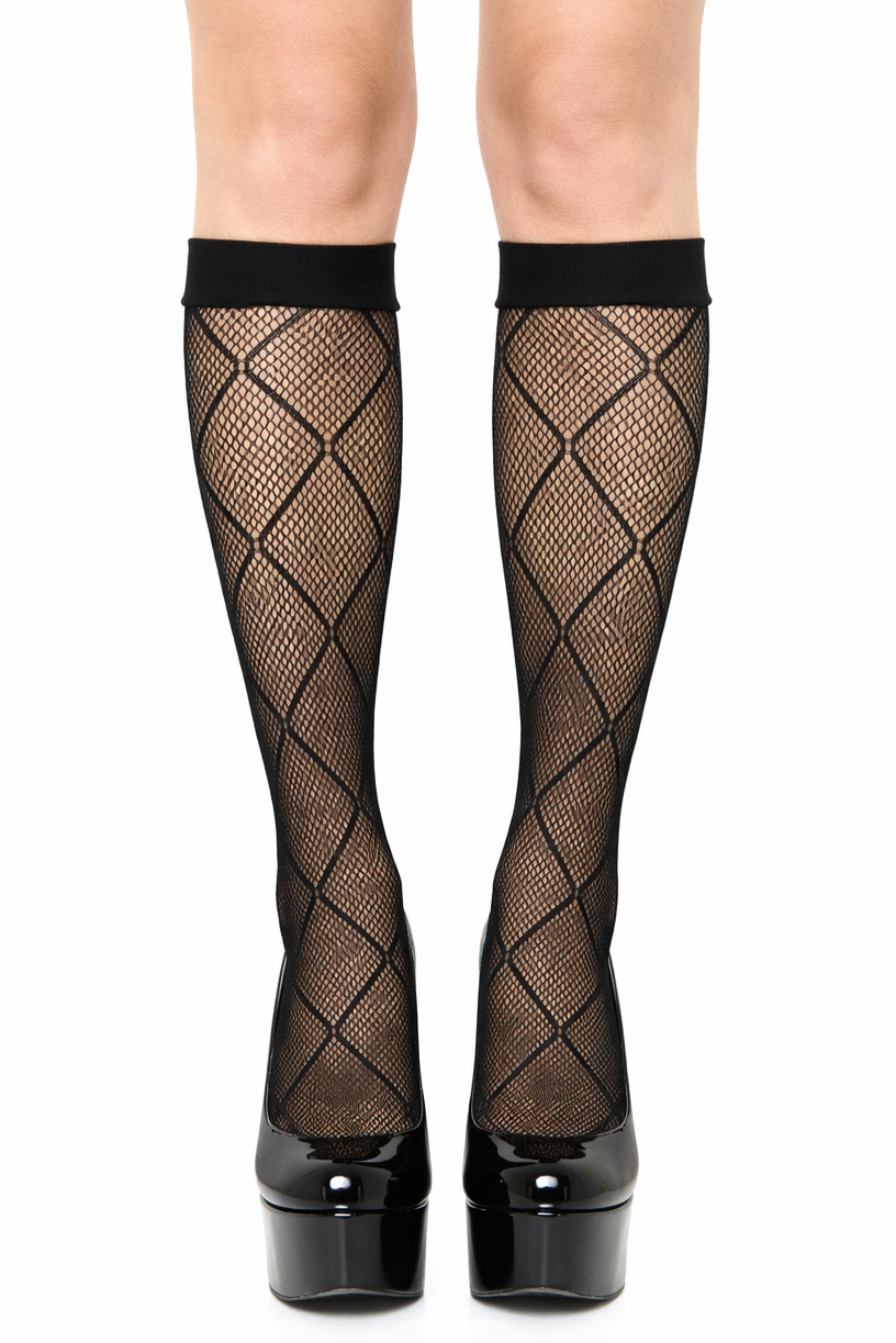 Black fishnet stockings with platform shoes on a white background