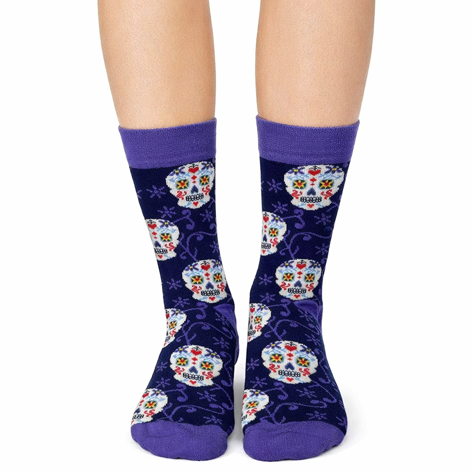 Colorful skull-patterned socks with purple accents on a white background