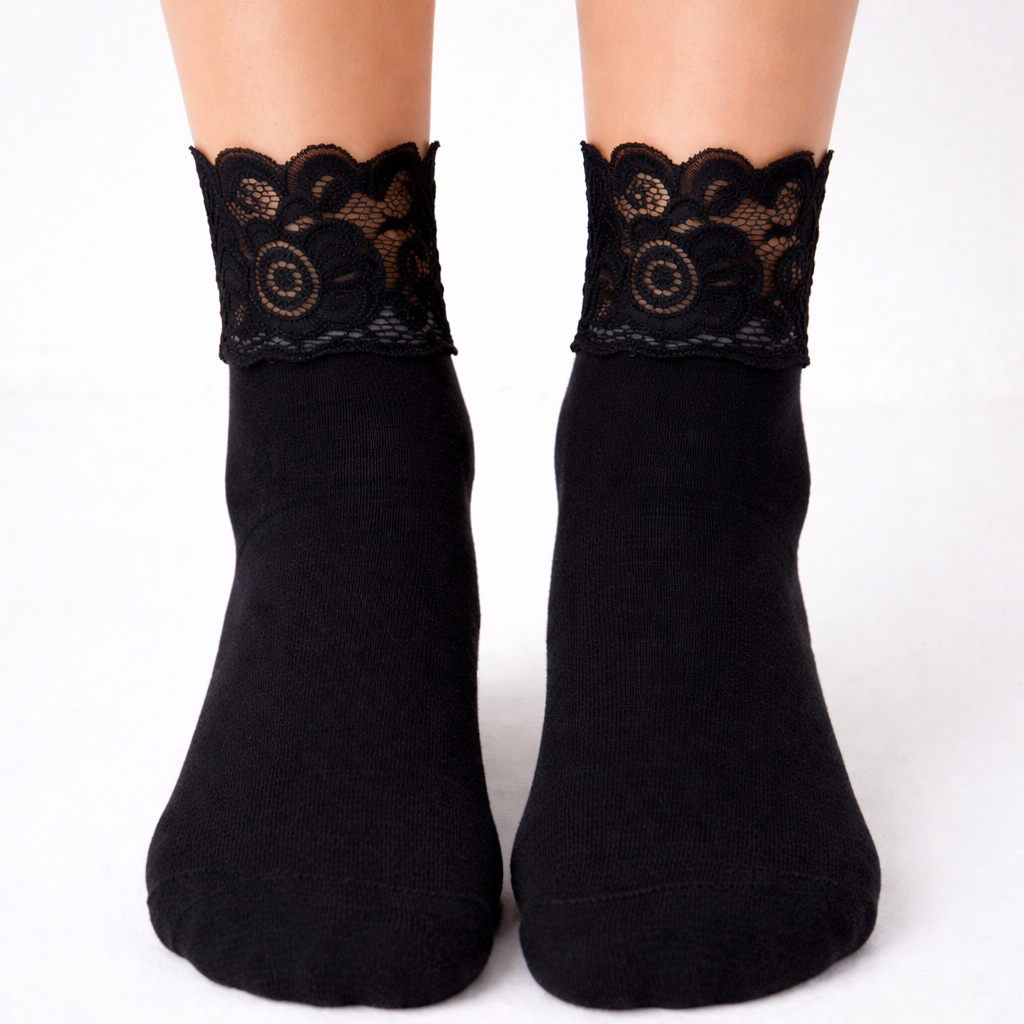 Black socks with lace trim on a white background