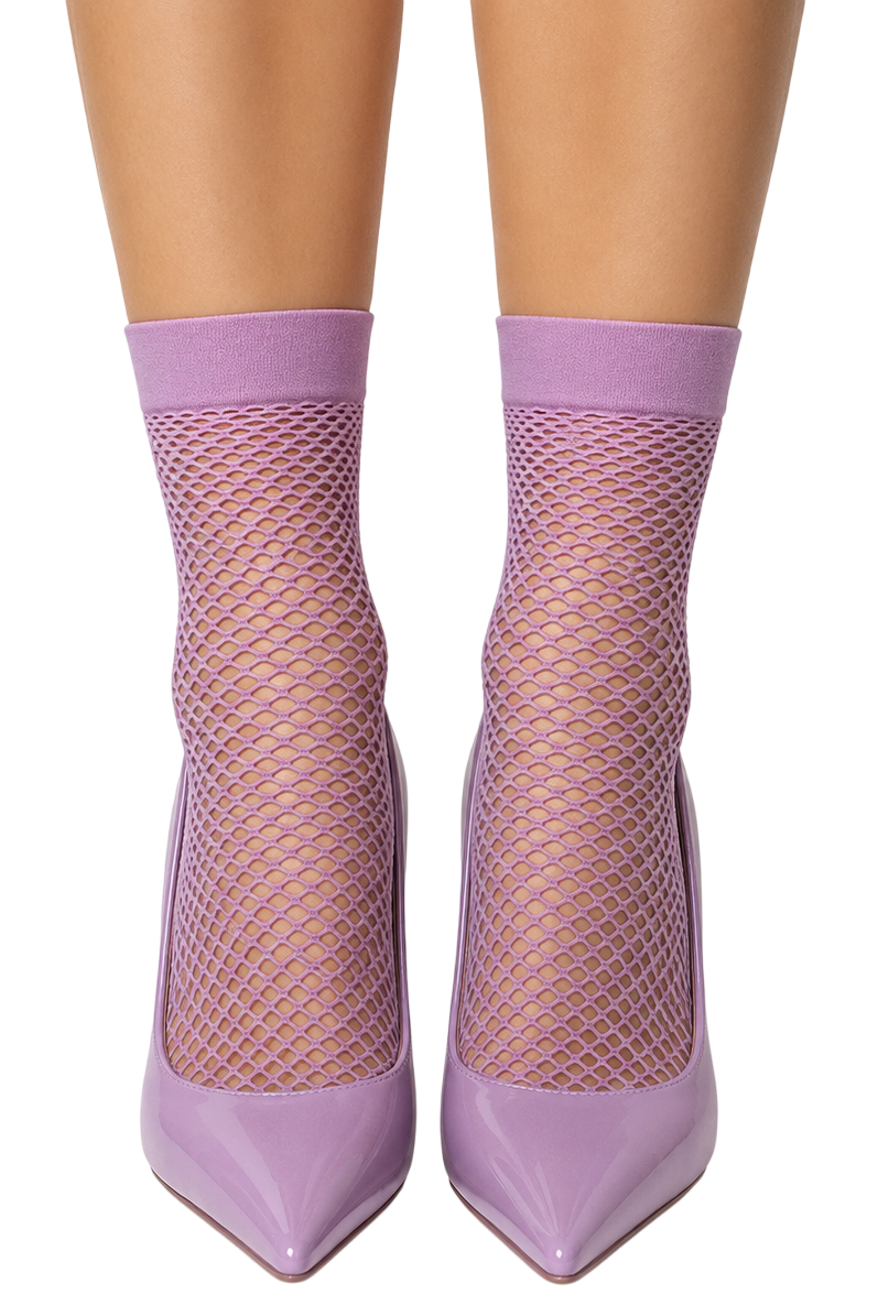 A pair of lavender fishnet ankle socks worn with matching pointed-toe high heels, shown on a model's legs against a plain white background.