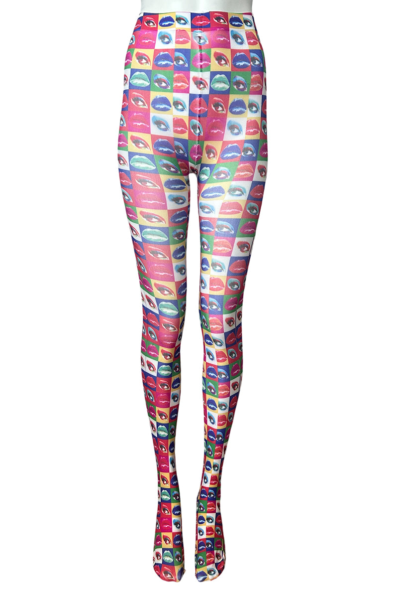 High-waisted leggings with a colorful repeating pattern of stylized lips and eyes in pink, blue, green, yellow, and red, shown on a white background.