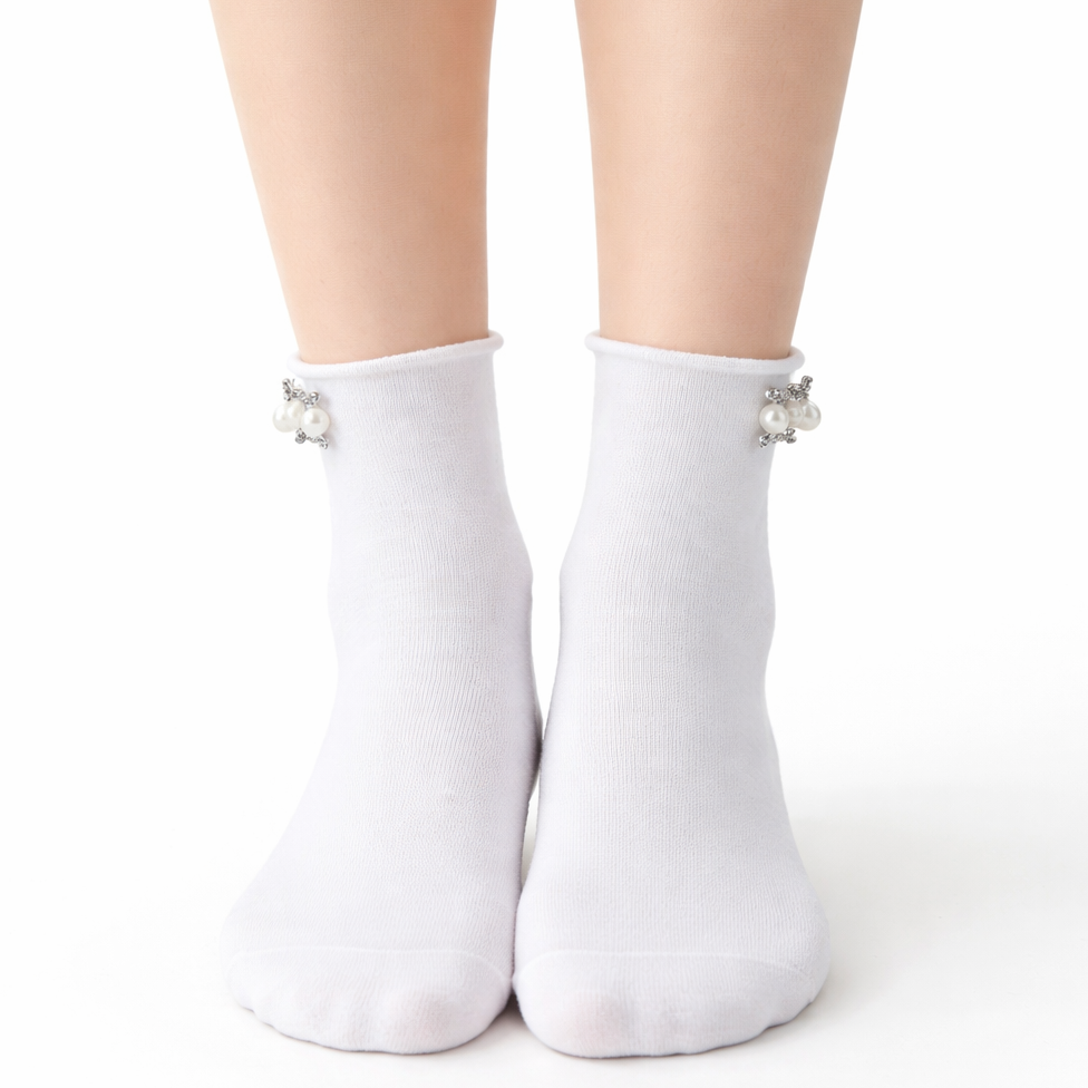 White ankle socks with decorative bows on a white background