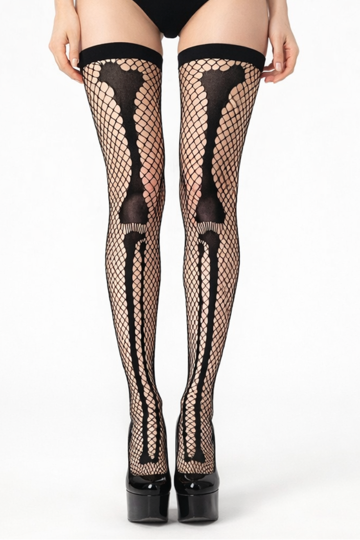 Black fishnet stockings with skeleton design worn by a model on a white background